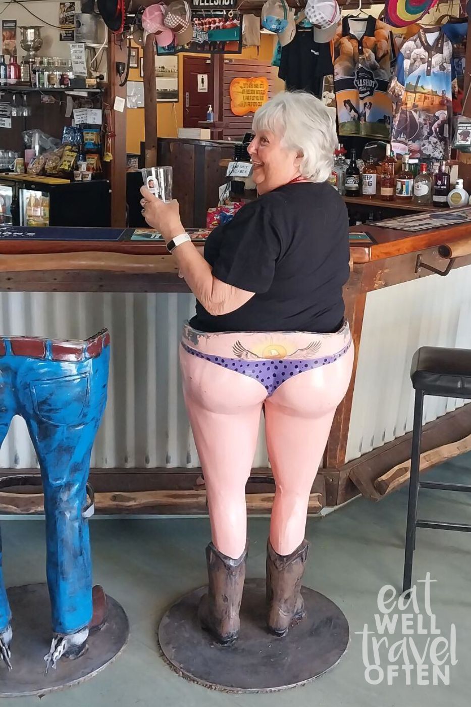 Karen in a humorous bar stool so it looks like she is wearing polka dot bikini bottoms